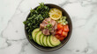 © siraphol - Fresh tuna poke bowl with avocado, seaweed, cucumber, tomato and lemon zest