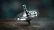 © DailyLens Studio - Close-up of a shiny metal spinning top spinning on a dark wooden table.