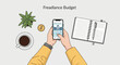 © arjuno - Vector illustration of hands using a mobile banking app for freelance budget management on a desk with a coffee cup, gold coin, succulent, open spiral notebook, and pen.