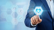 © SmartTech - Businessman interacting with futuristic digital healthcare and wellness interface