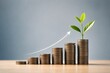 © Bear - Growing stack of coins with a plant representing investment and financial growth.