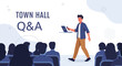 © Raden - Town Hall Q&A Session: Speaker Presents to Audience with Laptop and Phone