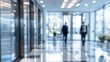 © Ndoomyim - Blurred business office hallway with professionals walking in modern corporate interior architecture design concept.