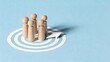 © Alex - Wooden figures standing on target with arrow pointing forward, business strategy and goal achievement concept, teamwork and leadership direction for success