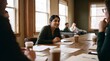 © ryker - Young woman leading casual meeting around wooden table with coffee cups and paperwork, natural light from windows, collaborative documentary style moment