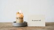 © Asmaa_Asmadi - Candle with action message and be present still card