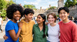 © Running opossum - group of diverse young friends enjoying outdoor gathering at city park on sunny day