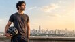 © JoyfulImages - Man holding bicycle helmet overlooking skyline copy space