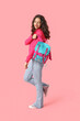 © Pixel-Shot - Female student with backpack on pink background