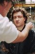 © Luciano Spinelli/Stocksy - Hair Stylist Working on a Model