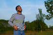 © Leire Cavia/Stocksy - Young man at blue sky sunset light