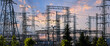 © SNEHIT PHOTO - Power substation distributing electricity at sunset with transmission lines