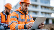 © Nataliya - Anonymous engineers using digital technology tools at a modern construction site, smart building and innovation concept, faceless, defocused, with copy space