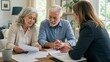 © Lilu - Elderly woman and man talking with professional advisor. Senior couple discussing financial document with lawyer. Consultation for legal protection and planning for International Day of Older Persons.
