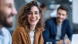 © sup - Woman laughing at business meeting
