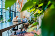 © Westend61 - Employees having a business meeting in a modern office with plants