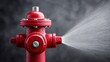 © LumeoStudio - Red fire hydrant spraying water against a dark background