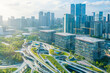© samael334 - Aerial view of Shenzhen futuristic urban district with green rooftop architecture and modern skyscrapers Sustainable city planning, innovative infrastructure and smart urban development, China