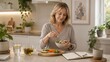 © Maryia - Healthy mature adult lifestyle concept with balanced meal, meal journal and plant-filled kitchen for menopause-friendly self care routine.