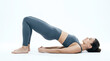 © ismail - Woman doing bridge yoga pose on floor
