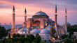 © Maria - Hagia sophia in istanbul illuminated at dusk, its iconic domes and four minarets glowing beneath a vivid pink and purple sunset, a unesco architectural and spiritual landmark