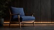 © gfxdesigner_tania - Modern blue armchair with wooden frame sits against dark wood paneling.