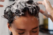 © Home-stock - Hair care rituals and cosmetics concept. Woman washing head caring for hair while taking shower at home, closeup