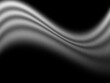 © Kiara - Monochrome abstrakte Lichtwellen mit Körnung auf schwarzem Hintergrund