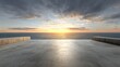 © Olga Ко - Palco vazio de concreto com vista para o mar no pôr do sol. Fundo de mockup em branco para apresentação automotiva ou de produtos