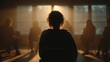 © scaliger - Silhouetted people sitting in a circle during a support group meeting. Anonymous individuals in a dark room with warm backlighting from windows. Group therapy and mental health counseling concept