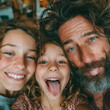 © cjsolanop - Warm family portrait, joyful expressions captured close up. Teen and child beam, father winks with playful charm. Sunlit room hints at casual, happy moments together. Perfect for lifestyle, family