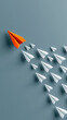 © pattozher - Leadership in Flight: A vibrant orange paper airplane leads a fleet of white paper airplanes in formation, symbolizing guidance and the power of innovation.