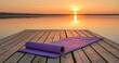 © krisna - Serene yoga mat on wooden dock at sunrise over calm lake