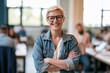 © Studio Nova - The Teacher in Denim Jacket Smiling in a Bright Classroom