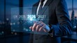 © Mayla - 2026 business planning and innovation concept entrepreneur selecting future year on virtual interface representing strategy, transformation. new