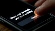 © Harry - Close up view of a finger pressing the deny button on a smartphone screen showing a privacy tracking request prompt