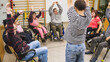 © DMegias - Diverse group of people with disabilities and a physiotherapist engaging in rehabilitation exercises, promoting health and inclusion