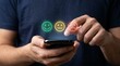 © Gophotograph - User experience evaluation concept showing a person selecting emoticon face ratings on a mobile device.