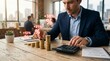 © Gophotograph - Calculating retirement compensation fund and dividend income using a calculator and coins.