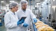 © Andrii  - Food Quality Control Specialists Inspecting Packaged Pasta on Production Line