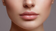© Studio ANNA - Woman's face showing beauty makeup with perfect, glowing skin and natural nude pink glossy lips