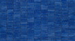 © EdisonArt - High angle view of modern dark blue mosaic rectangular ceramic tiles arranged in a neat geometric pattern for bathroom kitchen wall decoration.