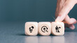 © Omid studio - Goal achievement and business success concept. Teamwork, brainstorm new idea, find out solution and strategy planning to improve, develop business. Businessman holds wooden cubes with 'success' icon.
