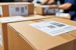 © Studio - Cardboard shipping boxes with barcode labels stacked in busy logistics warehouse distribution center, professional delivery service concept, close-up shot with selective focus.