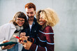 © Julia - Young friends laughing together in a small group