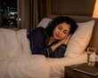 © Yogesh - young woman sleeping peacefully in luxury hotel room at night