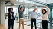 © Eve - Smiling diverse businesspeople stretching hands and neck during active work break in modern glass office, multiethnic happy team practicing executive corporate wellness and health care.