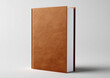 © Adriyanca - A blank, closed, hardback book with a textured brown cover stands upright