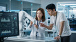 © CoreSelect - 로봇 팔 앞에서 논의하는 개발자 팀 / Developer Team Discussing beside a Robotic Arm