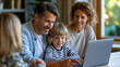 © Nataliya - Anonymous military couple video calling deployed relatives on a laptop with their children gathered around, long-distance military family connection concept, faceless, defocused,